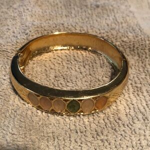 Gold bracelet with multiple colored stones, spring hinged